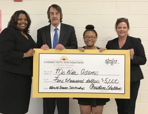 Northern High School graduating senior Nia Adams (second from right) is the recipient of the 2017 Alice Bowen Memorial Scholarship. Presenting the check are (from left to right) Christine Shelton of the Community Foundation of Southern Maryland, Bruce Bowen, and Betsy Hicks of Century 21 New Millennium. (click to enlarge)